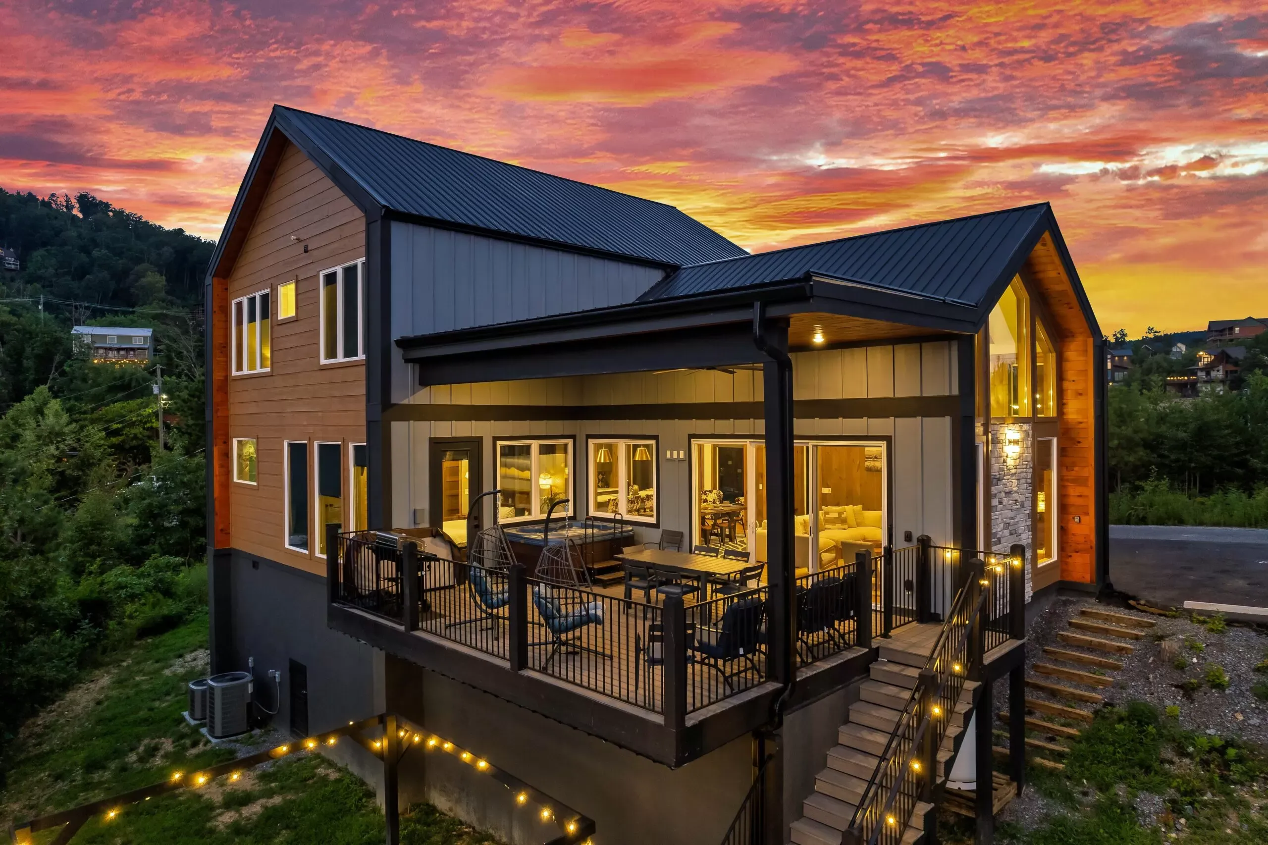 Exterior of Moonlight Chalet with wraparound deck and mountain backdrop